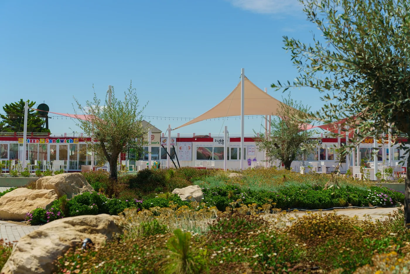 White awnings over the park pavilions